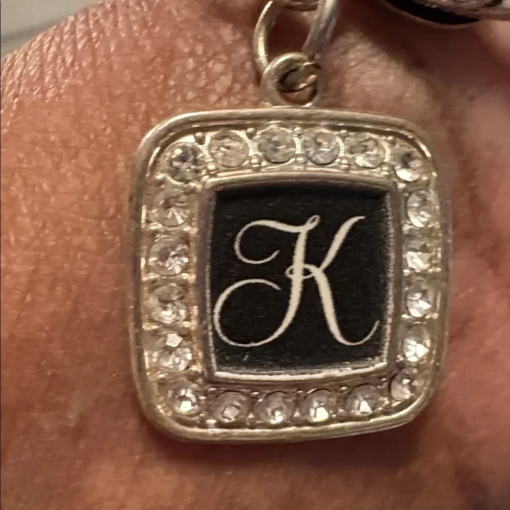 Elegant Silvertone Bracelet with Black Charm K, inscribed - Picture 2 of 5